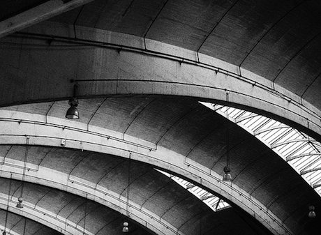 Black and white image of Stockwell bus garage roof interior featuring a large unsupported concrete span.